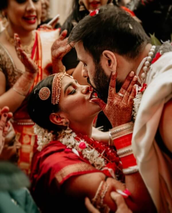 Candid Couple Shot - Bride in a Red Sequinned Lehenga and … | Indian wedding  photography poses, Indian wedding photography couples, Wedding couple poses  photography